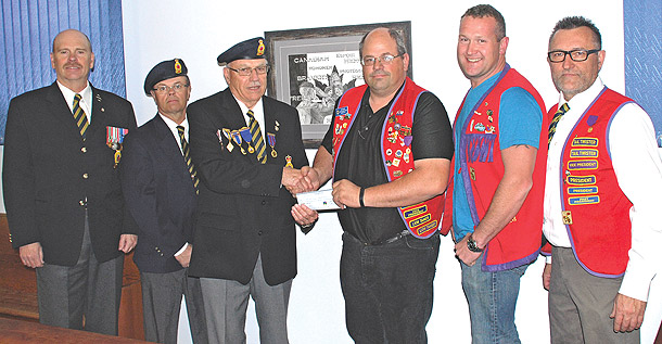 The Killam Lions presented Killam Legion Branch #65 with a cheque for the full cost of materials and shingles to            re-do the Legion roof. From left: Legion President Mike Fawcett, Russell Moore, Lloyd Franke, Rick Krys, James Moser, and Darcy Eskra.