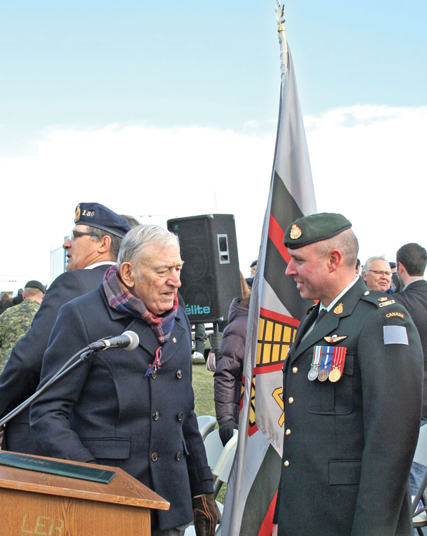 John Kinross Kennedy speaks with Loyal Edmonton Regiment Deputy Commanding Officer Major John McCully after Saturday’s rededication service. Kennedy also took time to speak to many visitors to thank them for coming. As a special gift, family members received spent shell casings from the three volleys fired during the ceremony. 