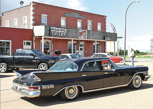 Alvin Meyer and his drivers picked up visitors at the train tracks in one of four         classic cars, providing them with a tour of the village before dropping them off at the historic Heisler Hotel.