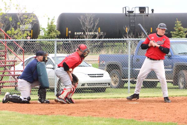 Heisler back catcher Blaine Wolbeck sacrifices his body to stop the ball and save a possible steal in tournament action in Heisler on Saturday,May 31.