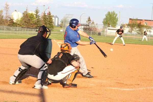 Lougheed batter John Snethun connects on a pitch against the Rosalind A’s in senior men’s tournament play in Heisler on Saturday, May 31.