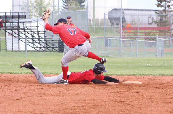 Second baseman Trent Steil makes the pick on a Castor base runner.