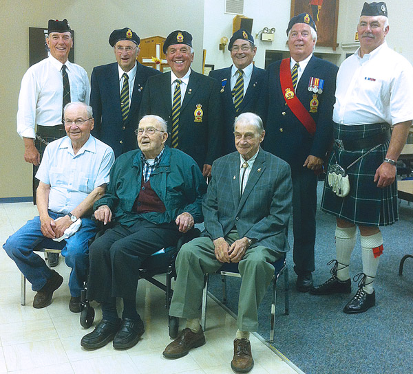 Pictured above (seated left to right): Grant Cheram, Nelson Bergum, and Bert Braiden. Standing left to right: Colour Party members, Jim McLeod (drummer), Dr. Jean Herbert, David “Jock” Muirhead, Art Read, Sgt. at Arms Perry Robinson, Piper Doug Brown. Missing is Piper David Samm. 
