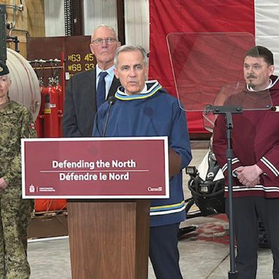 Prime Minister Mark Carney's first trip within Canada brought him to Iqaluit on March 18. From left, Chief of Defence Staff Gen. Jennie Carignan, Defence Minister Bill Blair, Prime Minister Mark Carney and Nunavut Premier P.J. Akeeagok. Kira Wronska Dorward/NNSL photo Kira Wronska Dorward, Local Journalism Initiative Reporter