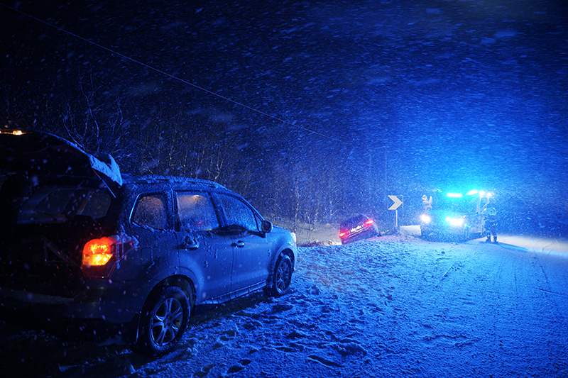 car accident on slippery winter road at night